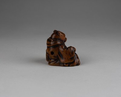 Netsuke - Model representing a fox disguised as a priest. Edo Japan