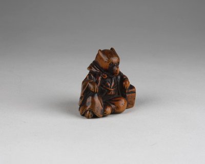 Netsuke - Model representing a fox disguised as a priest. Edo Japan