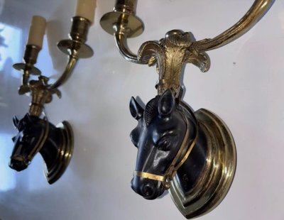 Maison BAGUES, Pair of Gilded Bronze And Black Patina Horse Wall Lights