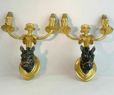 Maison BAGUES, Pair of Gilded Bronze And Black Patina Horse Wall Lights
