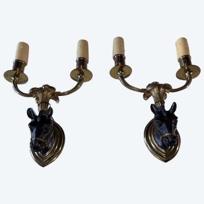 Maison BAGUES, Pair of Gilded Bronze And Black Patina Horse Wall Lights