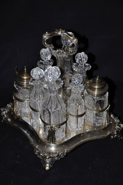 Crystal condiment set with silver frame