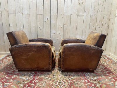 Paire de fauteuils Club en cuir usés 