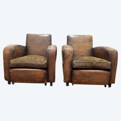 Paire de fauteuils Club en cuir usés 