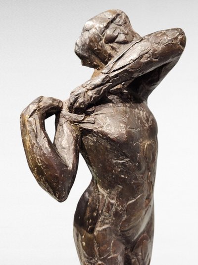 Dancer stapling the epaulette to her bodice - Edgar Degas, Valsuani cast, 1998