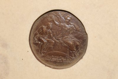 Pair of carved marble medallions with women's profiles in low relief by Louis Bottée expo 1889