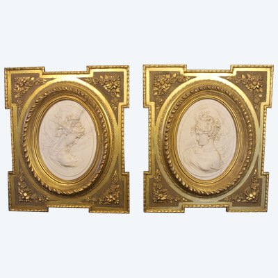 Pair of carved marble medallions with women's profiles in low relief by Louis Bottée expo 1889