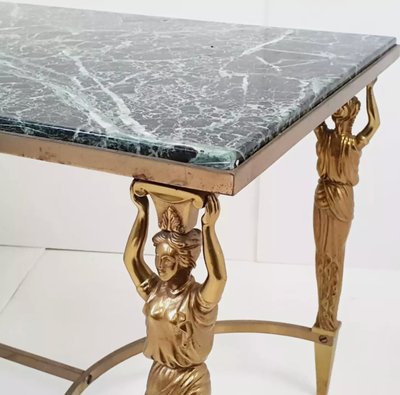 Maison JANSEN Table basse en bronze et laiton doré, cariatides et marbre