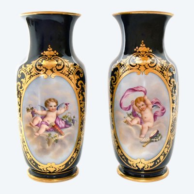 Pair of porcelain of Paris vases decorated with putti scenes