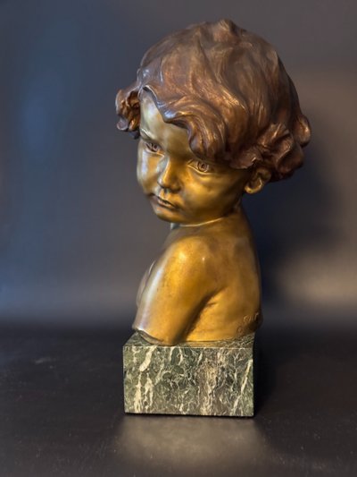 J.-M. CAMUS Large bust of a child in gilded and patinated bronze.
