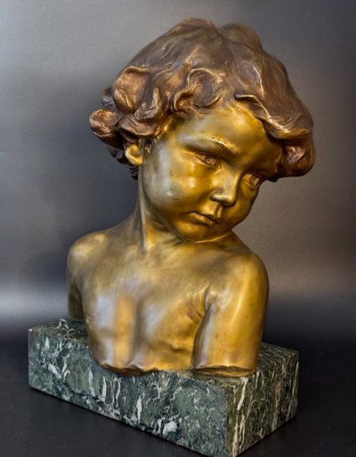 J.-M. CAMUS Large bust of a child in gilded and patinated bronze.