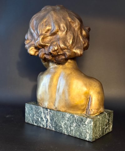 J.-M. CAMUS Large bust of a child in gilded and patinated bronze.