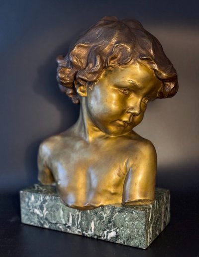 J.-M. CAMUS Large bust of a child in gilded and patinated bronze.