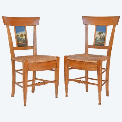 Pair of chairs with barrette backs and bands painted with animated landscapes