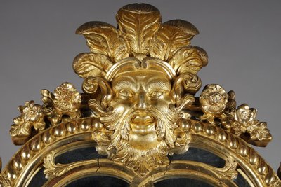 LARGE MIRROR WITH GLAZING BEADS DECORATED WITH SHELLS, FOLIAGE AND MASKS