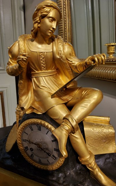 Clock with the "Painter Raphael" in gilded and patinated bronzes Restoration period 19th century