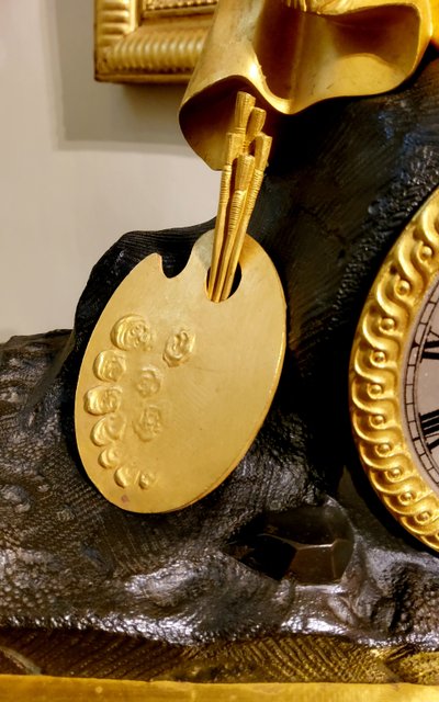 Clock with the "Painter Raphael" in gilded and patinated bronzes Restoration period 19th century