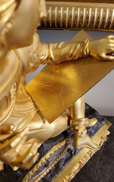 Clock with the "Painter Raphael" in gilded and patinated bronzes Restoration period 19th century
