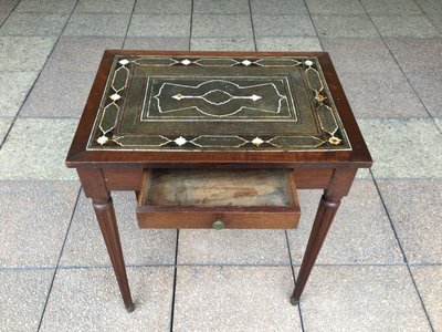 A small Louis XVI mahogany side table with an oriental-style top