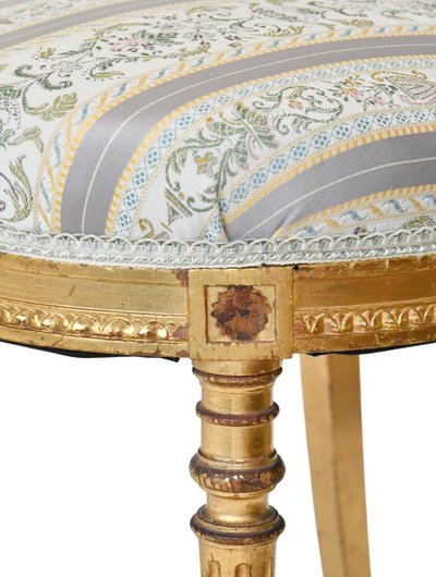 Pair of Louis XVI style chairs in gilded wood