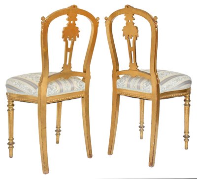 Pair of Louis XVI style chairs in gilded wood