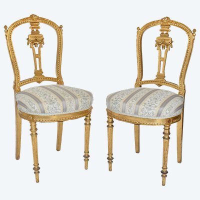 Pair of Louis XVI style chairs in gilded wood
