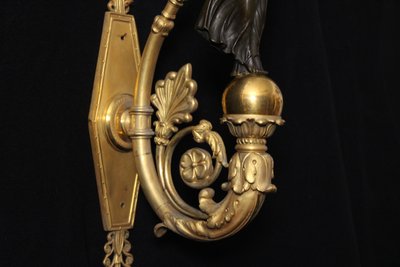 Empire wall lamp in gilded and patinated bronze with Fame, 19th century