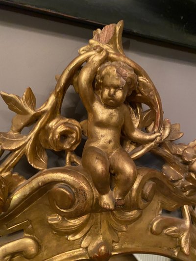 Gilded mirror, oval, 18th century
