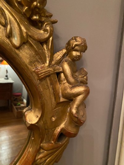 Gilded mirror, oval, 18th century