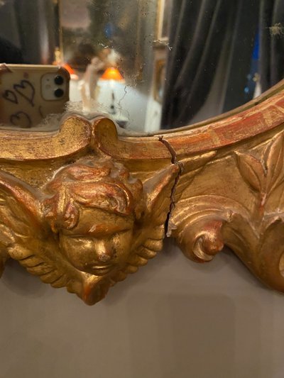 Gilded mirror, oval, 18th century
