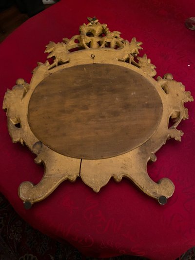 Gilded mirror, oval, 18th century