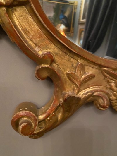 Gilded mirror, oval, 18th century