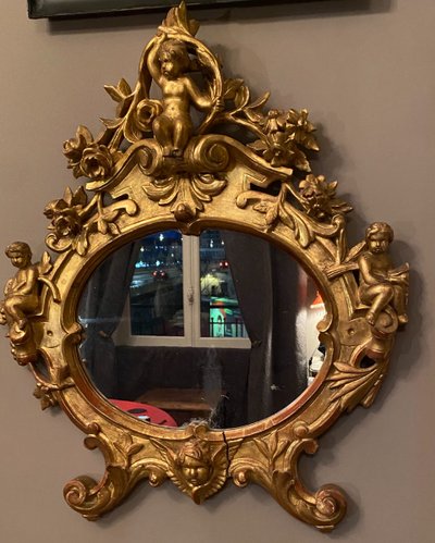 Gilded mirror, oval, 18th century