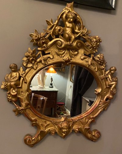 Gilded mirror, oval, 18th century