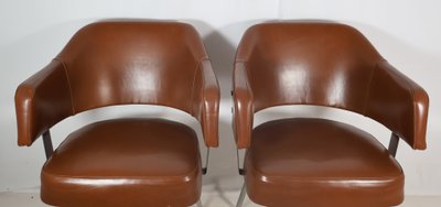 Pair of 50s-60s leatherette armchairs
