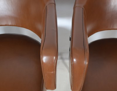 Pair of 50s-60s leatherette armchairs
