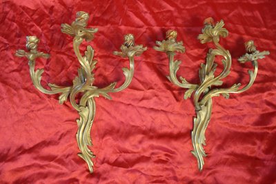 Pair of bronze sconces with 3 light arms in the Louis XV style, 19th century h: 45 cm