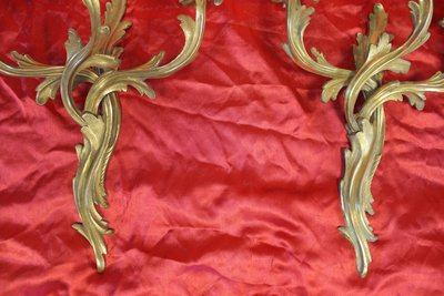 Pair of bronze sconces with 3 light arms in the Louis XV style, 19th century h: 45 cm