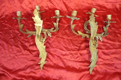Pair of bronze sconces with 3 light arms in the Louis XV style, 19th century h: 45 cm