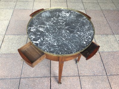 A pedestal table called a "bouillotte table"