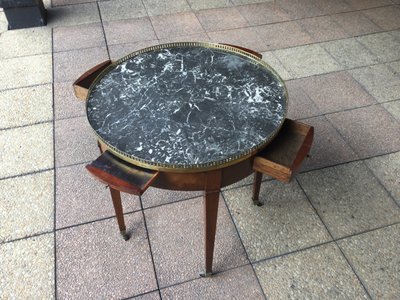 A pedestal table called a "bouillotte table"