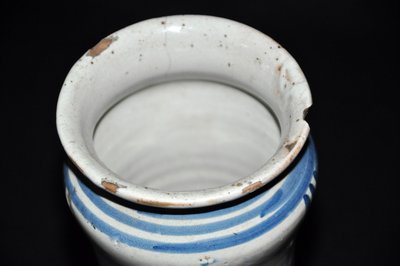 Albarelo in earthenware decorated in blue monochrome with a cherub motif, late 17th century