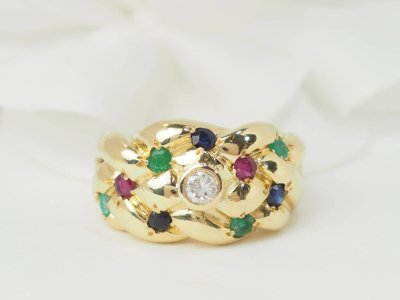 Bague jonc en or jaune et pierres précieuses 