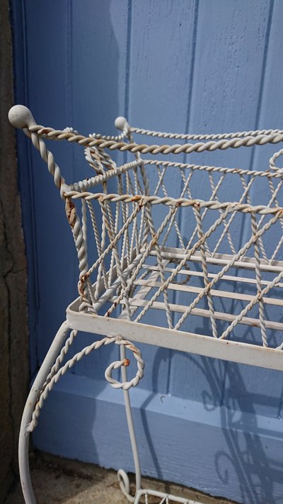 Planter on wrought-iron legs