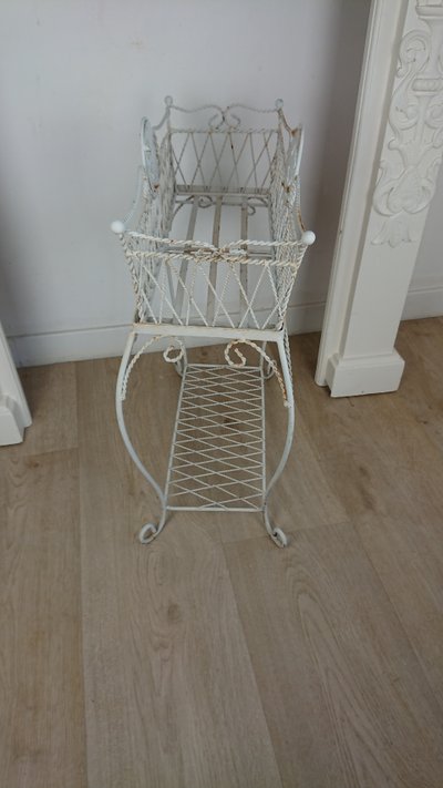 Planter on wrought-iron legs