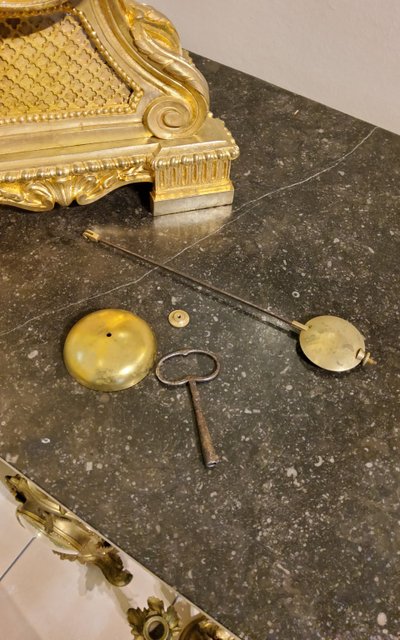Louis XVI style clock in gilded bronzes with Lions' heads Greek decor 19th century