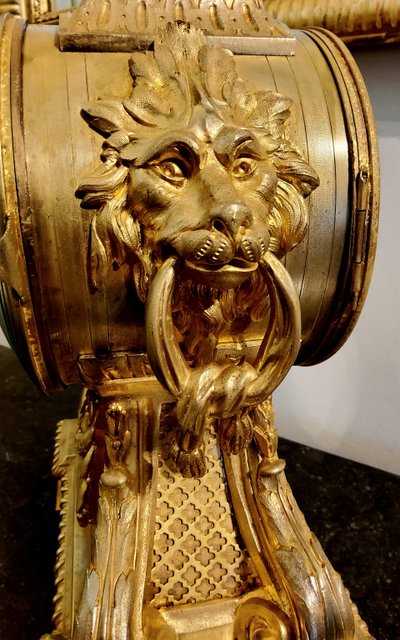 Louis XVI style clock in gilded bronzes with Lions' heads Greek decor 19th century