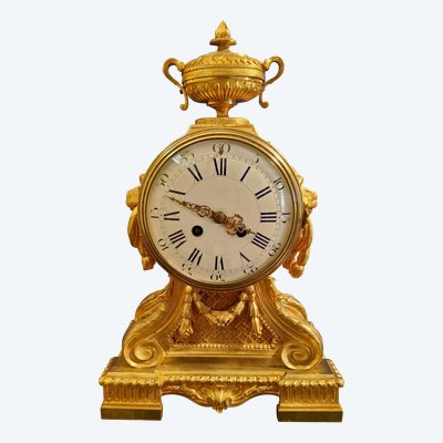 Louis XVI style clock in gilded bronzes with Lions' heads Greek decor 19th century
