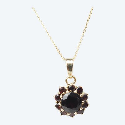 Collier pendentif marguerite en or jaune et grenats