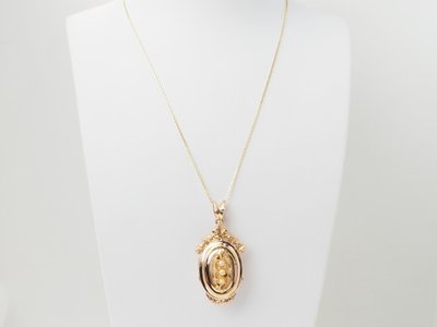 Collier pendentif cassolette en or jaune et perles fines